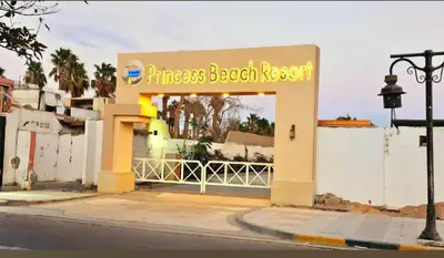 a entrance to a fitness beach resort on a street at Luxury Studio Pool & Free Private Beach, Close to Airport in Hurghada