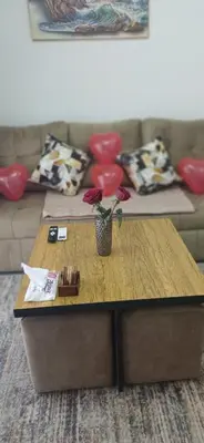 a coffee table in a living room with a couch at Luxury Studio Pool & Free Private Beach, Close to Airport in Hurghada
