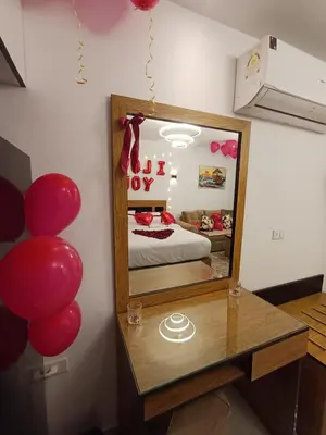 a mirror in a room with a bed and balloons at Luxury Studio Pool & Free Private Beach, Close to Airport in Hurghada