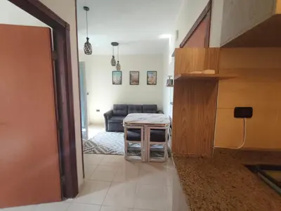 a living room with a couch and a table at Paradise Vibe Apartment in Hurghada