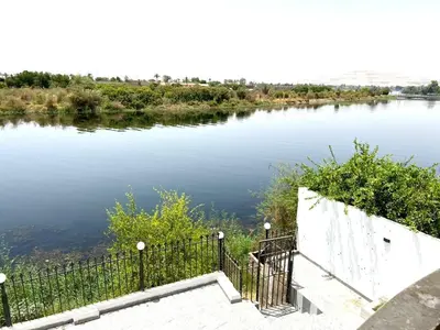 a view of a river from a bridge at Moon shadow in Luxor