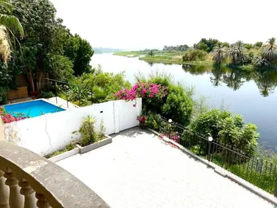 a view of a river from a balcony of a house at Moon shadow in Luxor