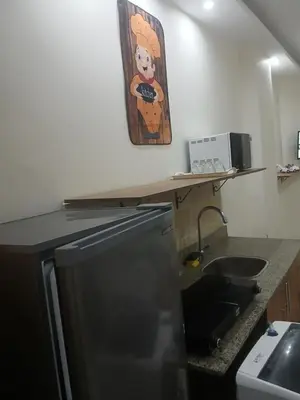 a kitchen with a counter with a sink and a microwave at كذا بلانكا بيتش417 in Hurghada