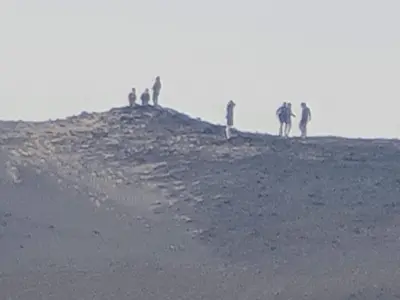 a group of people standing on top of a hill at Esmerada in Aswan