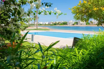 a view of a swimming pool in a resort at Nayah Stays, Joubal Lagoons Terrace in Hurghada