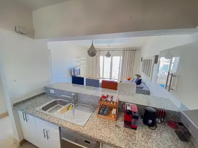 a kitchen with a sink and a counter top at Nayah Stays, Joubal Lagoons Terrace in Hurghada