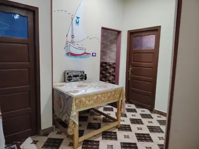 a small table in a room with two doors at Venti house in Aswan