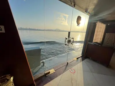 a view of the water through a glass door at Dahabiya Nile Cruise in Luxor