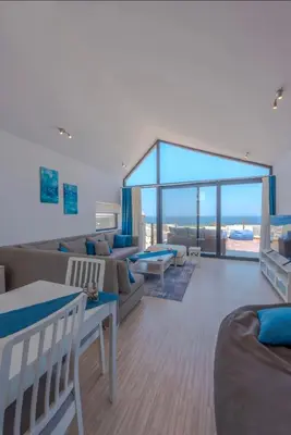 a living room with a couch and a table at Luxury Stays in Wadi Jebal Soma Bay in Hurghada