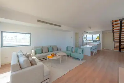a living room with a couch and a table at Luxury Stays in Wadi Jebal Soma Bay in Hurghada