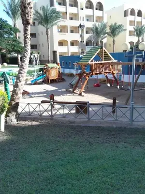 a park with a playground with a slide at Karma Aqua Beach in Hurghada