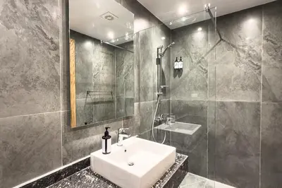 a bathroom with a sink and a shower at Elegance Serene 3 BDR Townhouse w Private Pool Bali Gouna in Hurghada