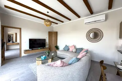 a living room with a couch and a table at Elegance Serene 3 BDR Townhouse w Private Pool Bali Gouna in Hurghada