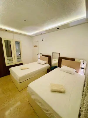 a hotel room with two beds in a room at Modern place Hurghada in Hurghada