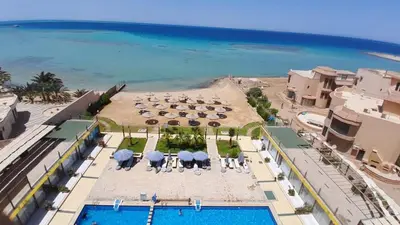 an aerial view of a resort with a pool and the ocean at كازابلانكا ستار in Hurghada