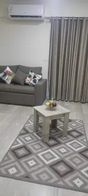 a living room with a couch and a coffee table at Princess resort217 in Hurghada