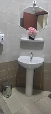 a bathroom with a sink and a mirror at Princess resort217 in Hurghada