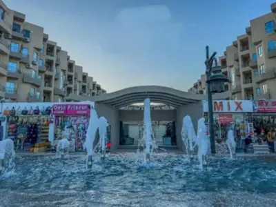 a water fountain in front of a building at Princess resort217 in Hurghada