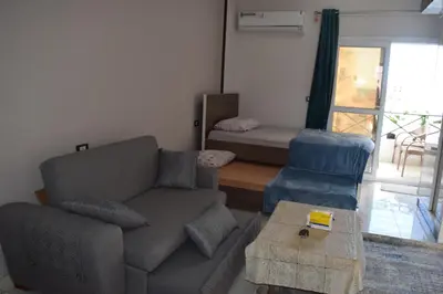 a living room with a couch and a table at Al Mutamayz Tiba in Hurghada