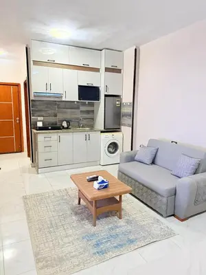 a living room with a couch and a coffee table at Al Mutamayz Tiba in Hurghada