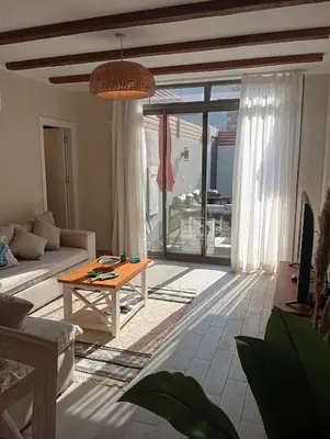 a living room with a couch and a table at Bali 2 bed with private pool in Hurghada