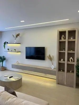 a living room with a tv on a wall at Stunning 3 bd penthouse with private pool - El Gouna in El Gouna