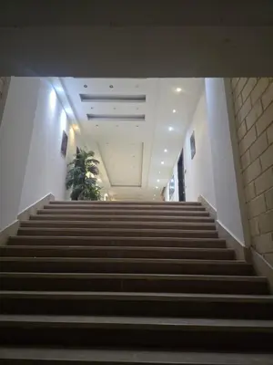 a stair case in a building with a bunch of stairs at Florenza Khamsin Sea front in Hurghada