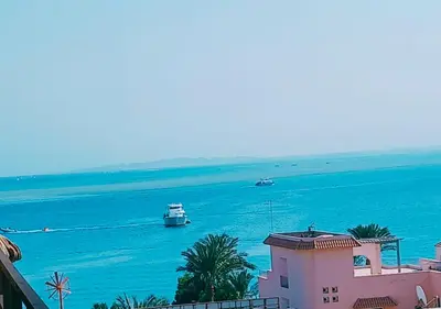 a view of the ocean with boats in the water at Modern Sea View Palma House Steps from Dream Beach in Hurghada