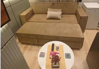a small living room with a couch and a table at Modern Sea View Palma House Steps from Dream Beach in Hurghada