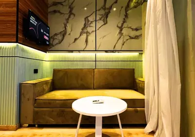 a couch and a table in a room at Modern Sea View Palma House Steps from Dream Beach in Hurghada