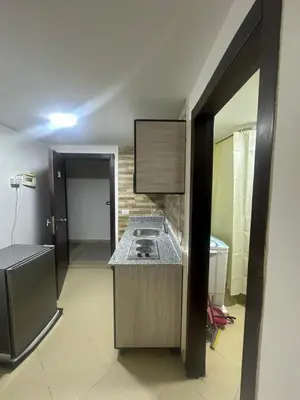 a kitchen with a counter with a stove in it at Balkan Resort in Hurghada