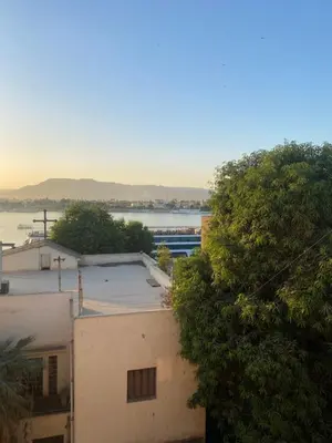 a view of the water from a building at Tut Apartment in Luxor