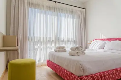 a bedroom with a bed with towels on it at VESTA - El Gouna Residence in Hurghada