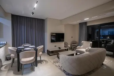 a living room with a couch and chairs and a table at The D9 Luxury Suites - Hurghada in Hurghada