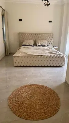a bedroom with a large bed with a large rug at Sea view 3 bedrooms apartment 06 in Hurghada