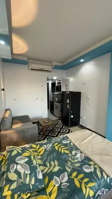a living room with a bed and a couch at سيسليا بيتش ريزورت in Hurghada