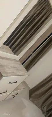 a white ceiling with wooden beams in a room at جولدن طيبه الذهبيه in Hurghada