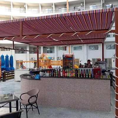 a bar in a restaurant with awning over it at Golden Tiba in Hurghada