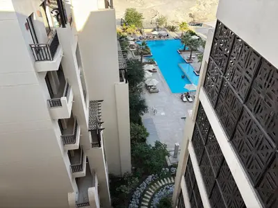 a view of the pool from the balcony of a building at Prime Square Aldau Heights in Hurghada