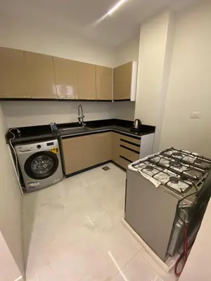 a small kitchen with a sink and a stove at Private 3 bedroom apartment in Hurghada