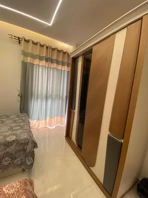 a bedroom with a large sliding glass door at Private 3 bedroom apartment in Hurghada