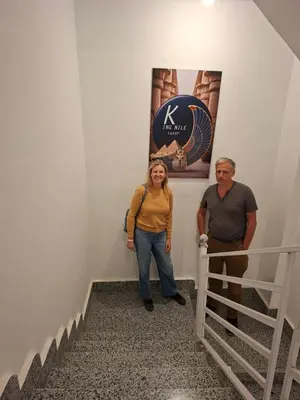 a man and a woman standing on the stairs at King Nile Luxor in Luxor