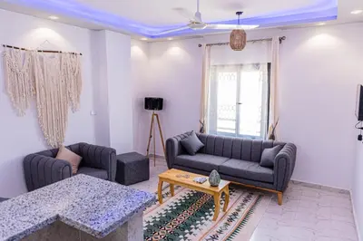 a living room with two couches and a table at Sultan's Suite-Chill Out Roof Terrace-3 Bedrooms in Hurghada