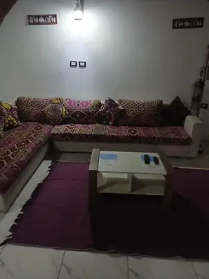 a living room with a couch and a coffee table at 3-Bed Sleeps 6 with Sea View & Free Parking in Hurghada