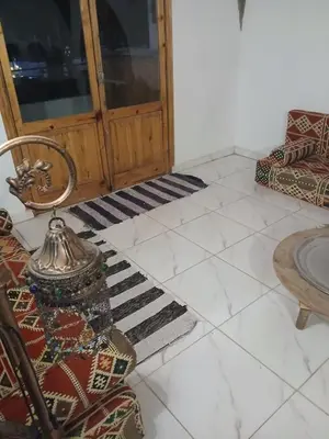 a living room with a couch and a table at 3-Bed Sleeps 6 with Sea View & Free Parking in Hurghada