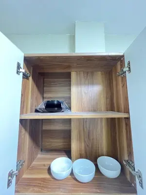a cupboard with three bowls and a plate in it at Studio in Nubia Aqua Beach Twin Room in Hurghada in Hurghada