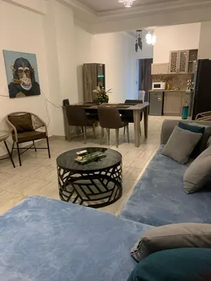 a living room with a couch and a table at Schöne Hotel -Apartment in Sky El Gandoul Hurghada in Hurghada