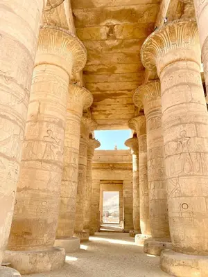 an archway of a building with reliefs on the walls at Royal Home Dome Style - Ground Floor Apartment in Jazīrat al ‘Awwāmīyah