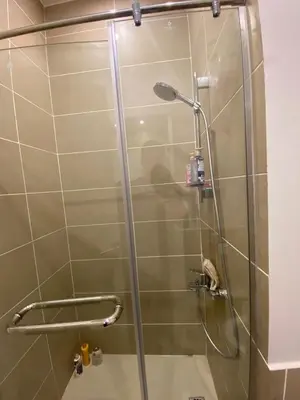 a shower with a glass door in a bathroom at Gouna 3 bedrooms townhouse cyan in Hurghada