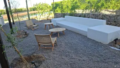 a white couch and two chairs and a table at Gouna 3 bedrooms townhouse cyan in Hurghada